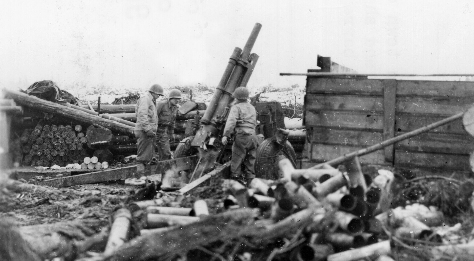 German positions were so close to this 8th Infantry Division artillery battery that the gunners had to fire their 105mm howitzer at maximum elevation.